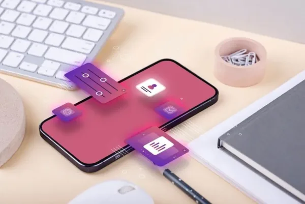 A imagem mostra um smartphone com diversos ícones e elementos gráficos, sugerindo uma interface de aplicativo ou plataforma digital. Nisso ilustra a importância do e-commerce omnichannel, pois uma plataforma integrada e com múltiplos recursos digitais pode oferecer uma experiência de compra e gestão mais eficiente e personalizada para os clientes, impactando positivamente a operação da empresa.