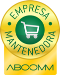 Selo circular dourado com o texto "EMPRESA MANTENEDORA" e um ícone de carrinho de compras, com o texto "ABCOMM" abaixo. Representa certificação ou associação relacionada ao comércio eletrônico.
